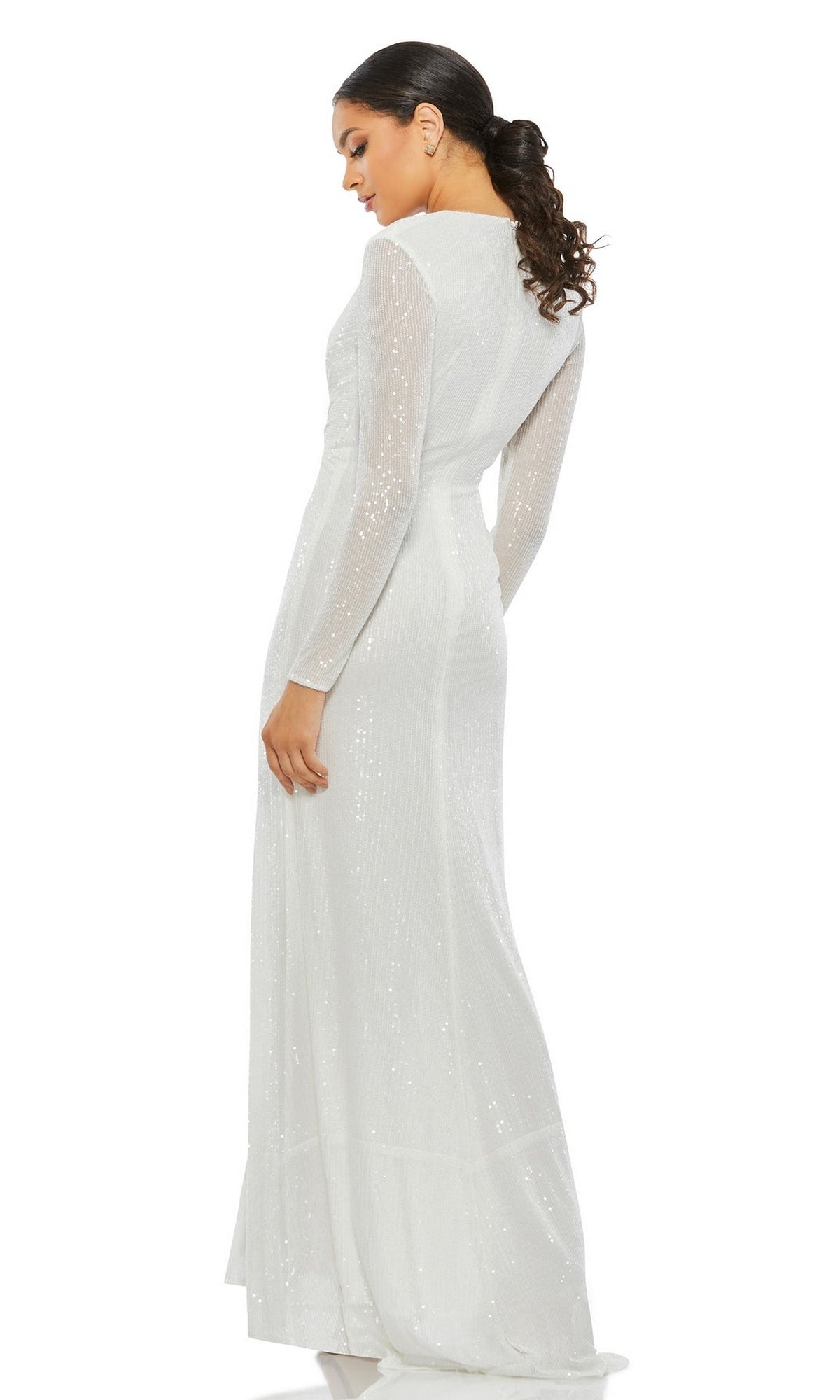 Woman wearing the Long Formal Dress 26552 by Mac Duggal, featuring long sleeves, a v-neckline, and subtle sequin details, stands looking over her shoulder.